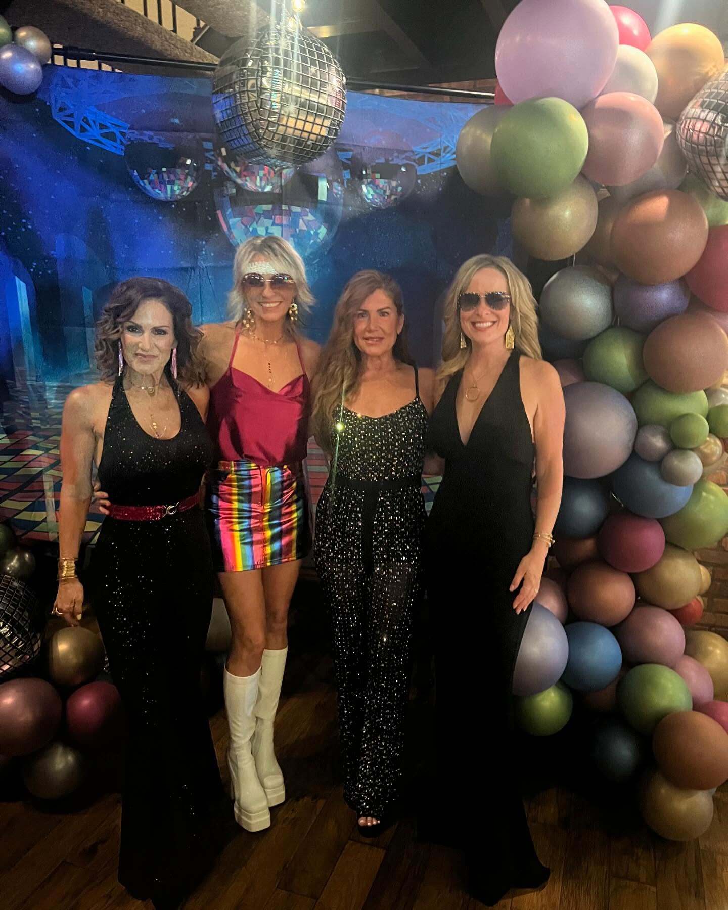 Women dressed for a DJ Russ Fritz retro dance party