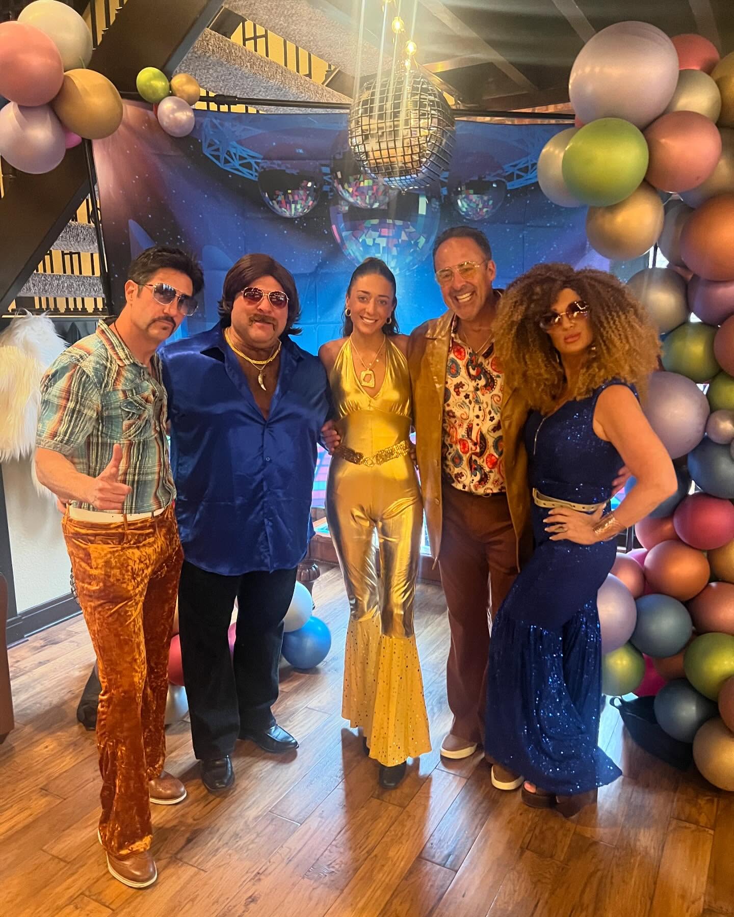 Group dressed for a 1970s and 1980s event
